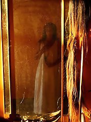 An amazing old lady is posing almost naked in stunning shots