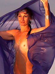 Beautiful sunset scenery by the shore of a salt lake, featuring a blue shawl