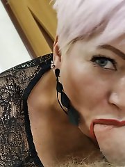 Aimee, a sexy mature woman, giving oral pleasure to a man